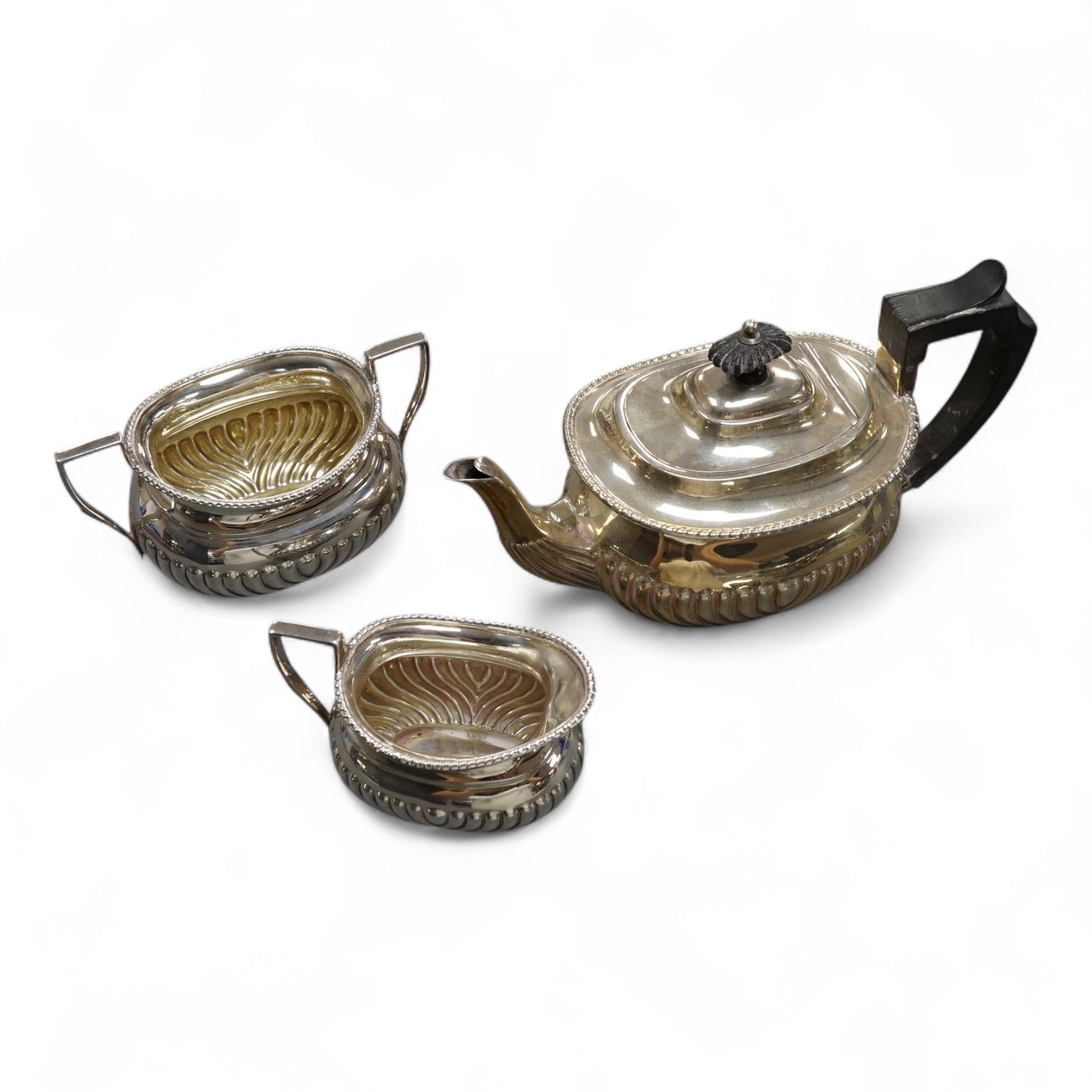 An early 20th century demi-fluted silver three piece tea set, Atkin Brothers, Sheffield, 1909/1911 & 1912, gross weight 22oz. Condition - fair to good